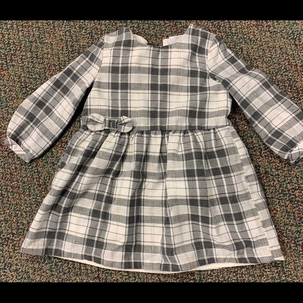 Baby long sleeved flannel dress with bow detail.